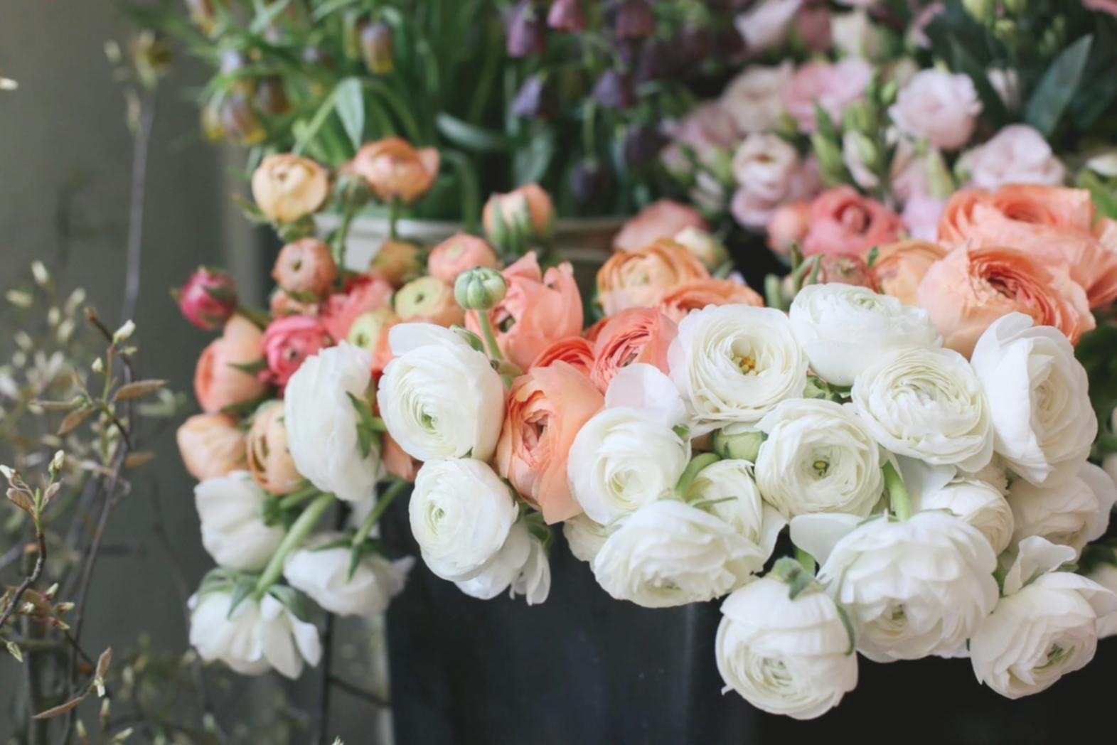 Expert floral designer creating personalized bouquet arrangement